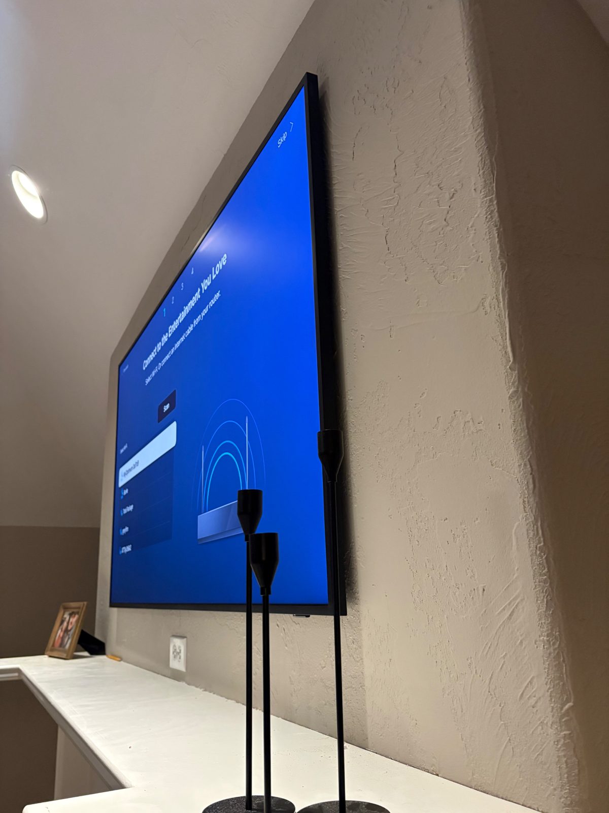 Samsung Frame TV mounted flush to the wall, side view