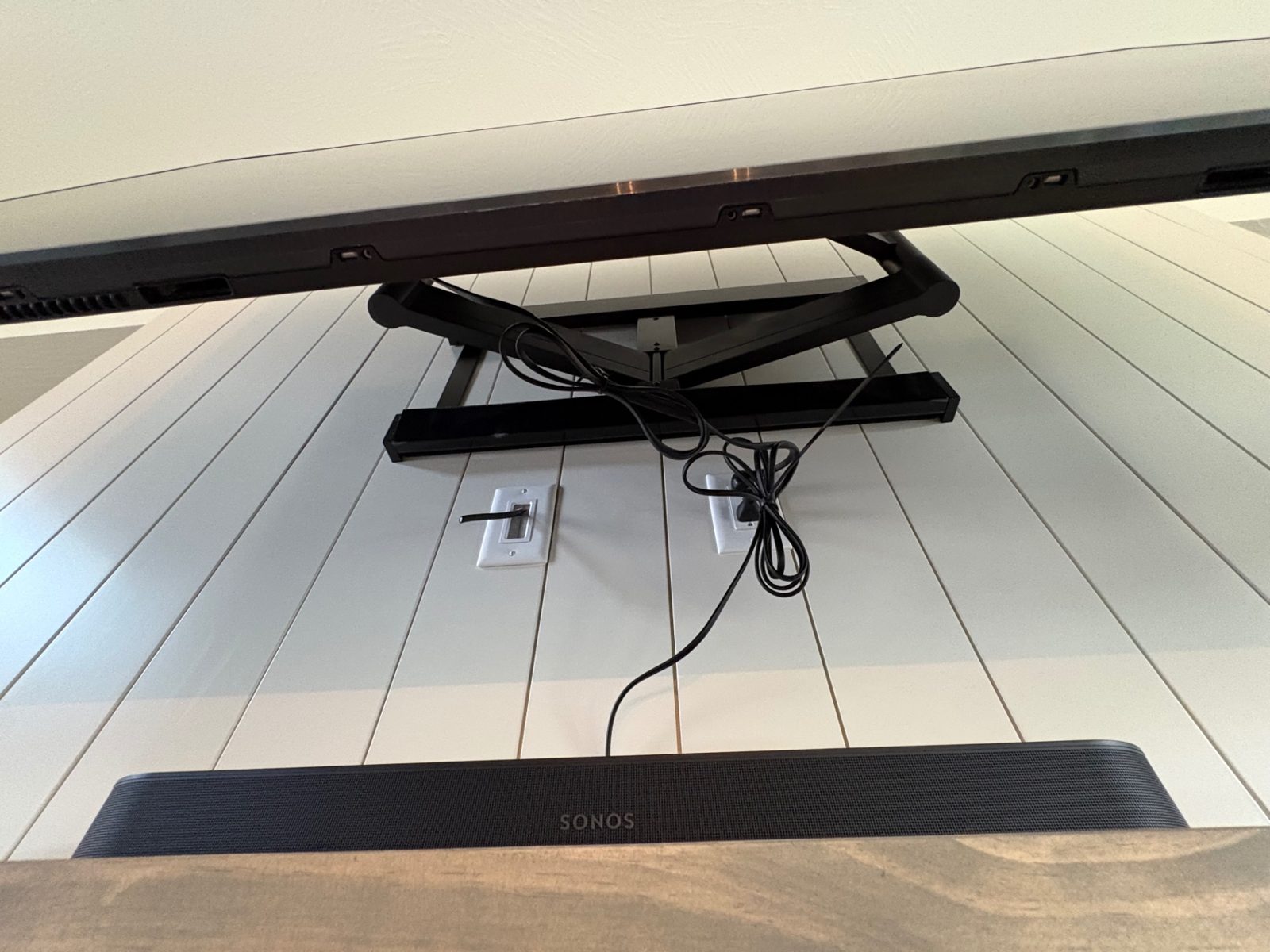 Heavy-duty articulating TV mount installed on the wall