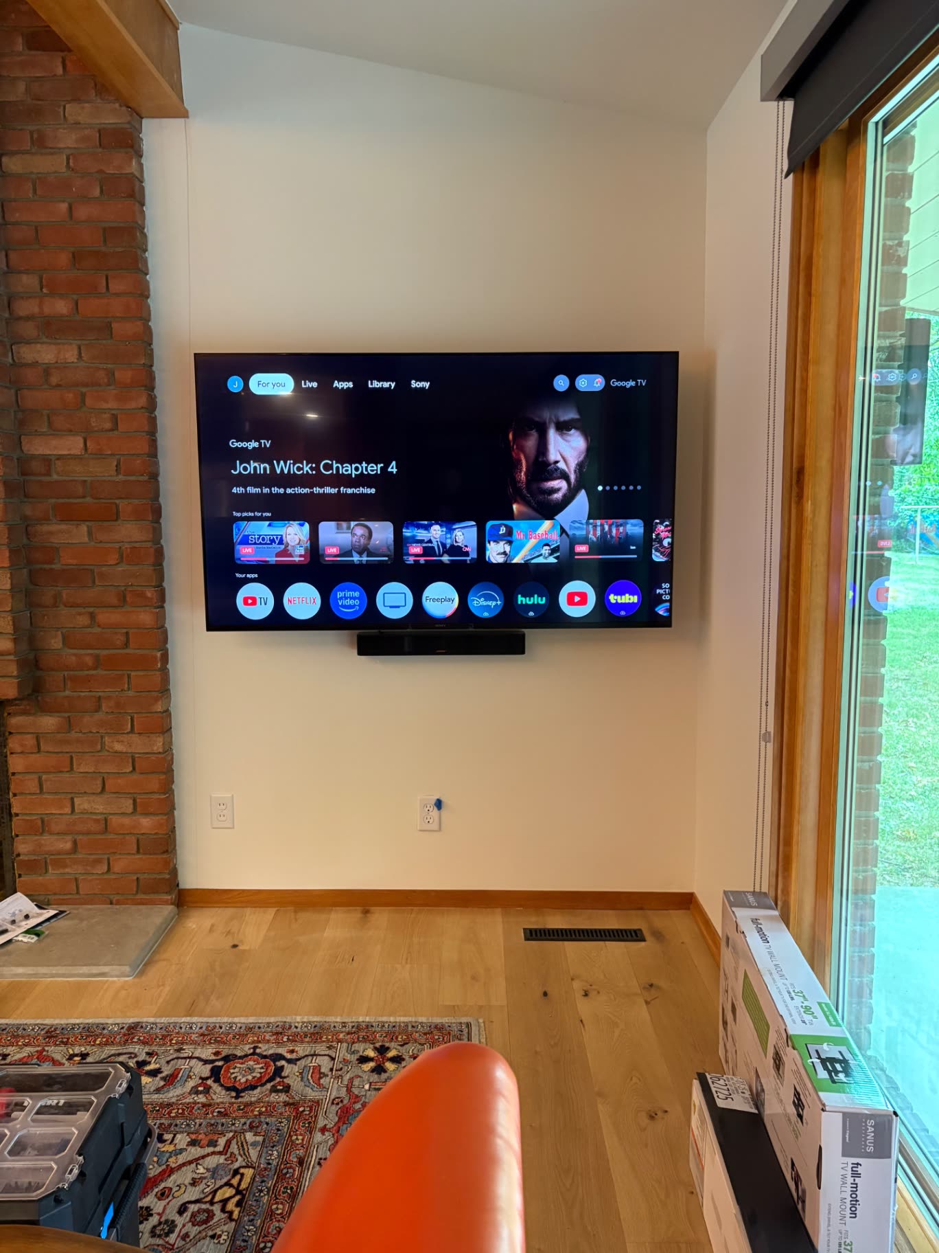 TV mounted on a bedroom wall
