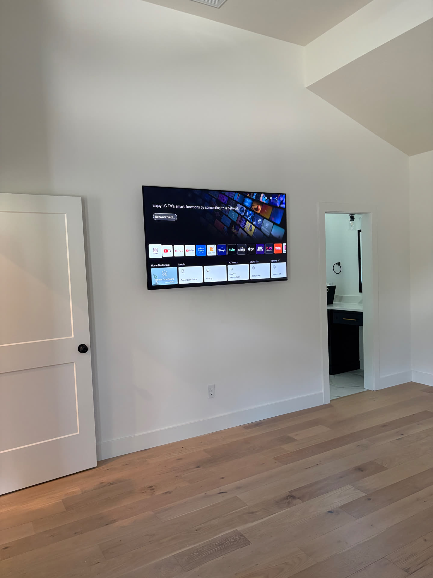 TV mounted on drywall with no visible cords